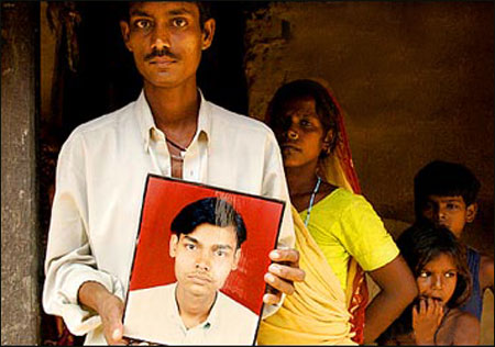 Relatives of these Nepalese people had been promised hotel jobs in Jordan, but were sent to Iraq to work as forced labor for Haliburton where they were kidnapped and killed. (photo by Jose More, Chicago Tribune)